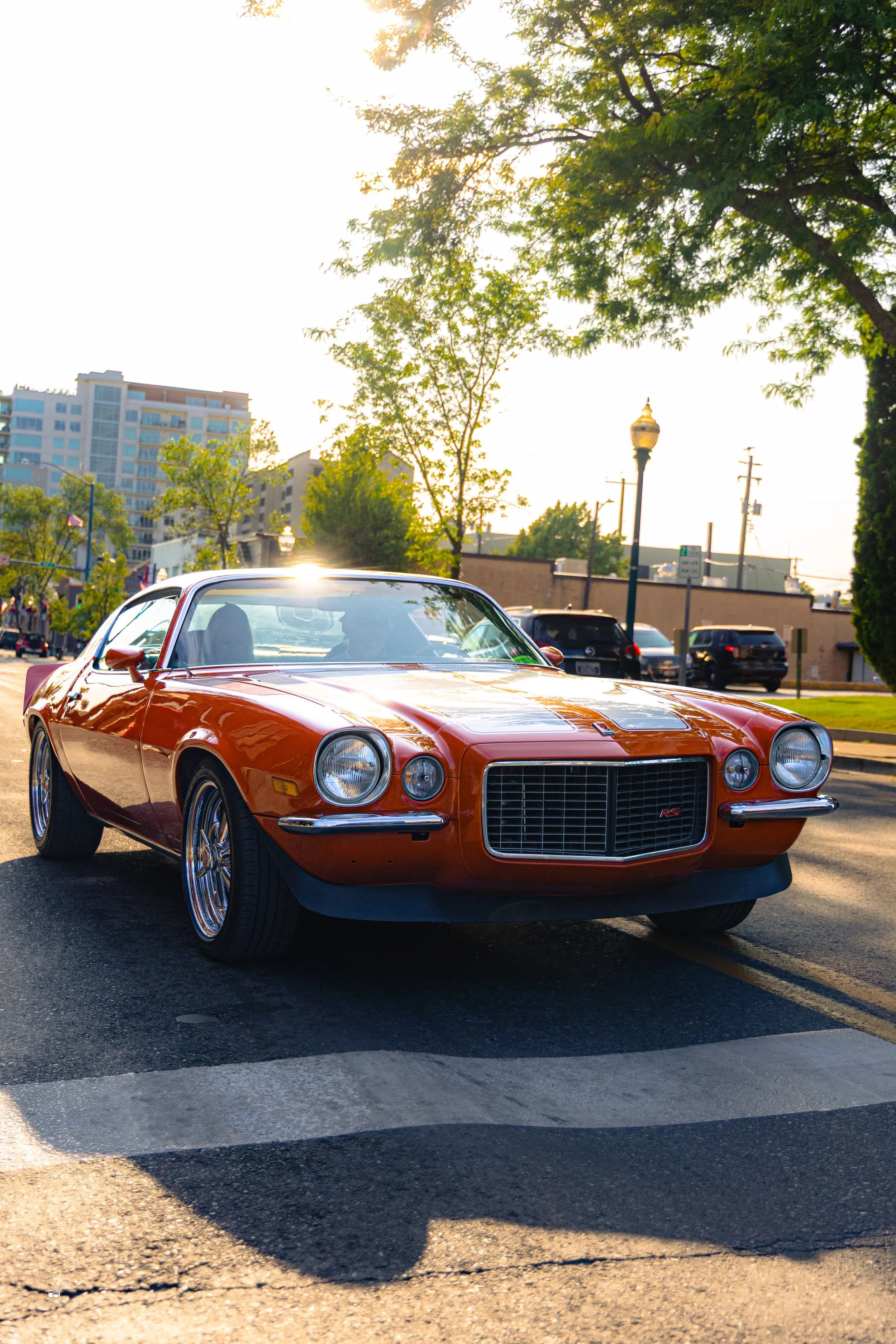 Orange Camaro at golden hour